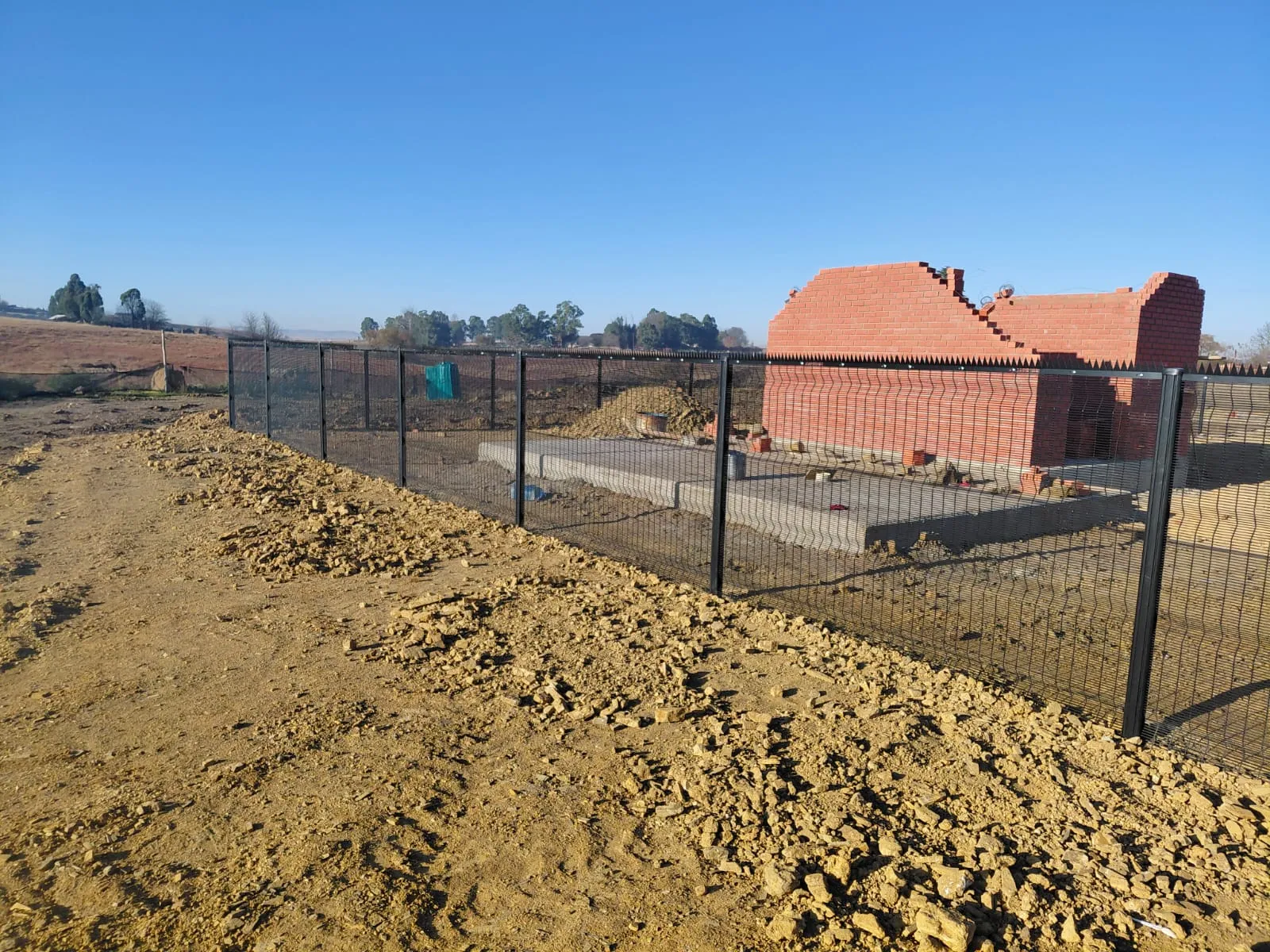 Capstone perimeter fence installation progress 3