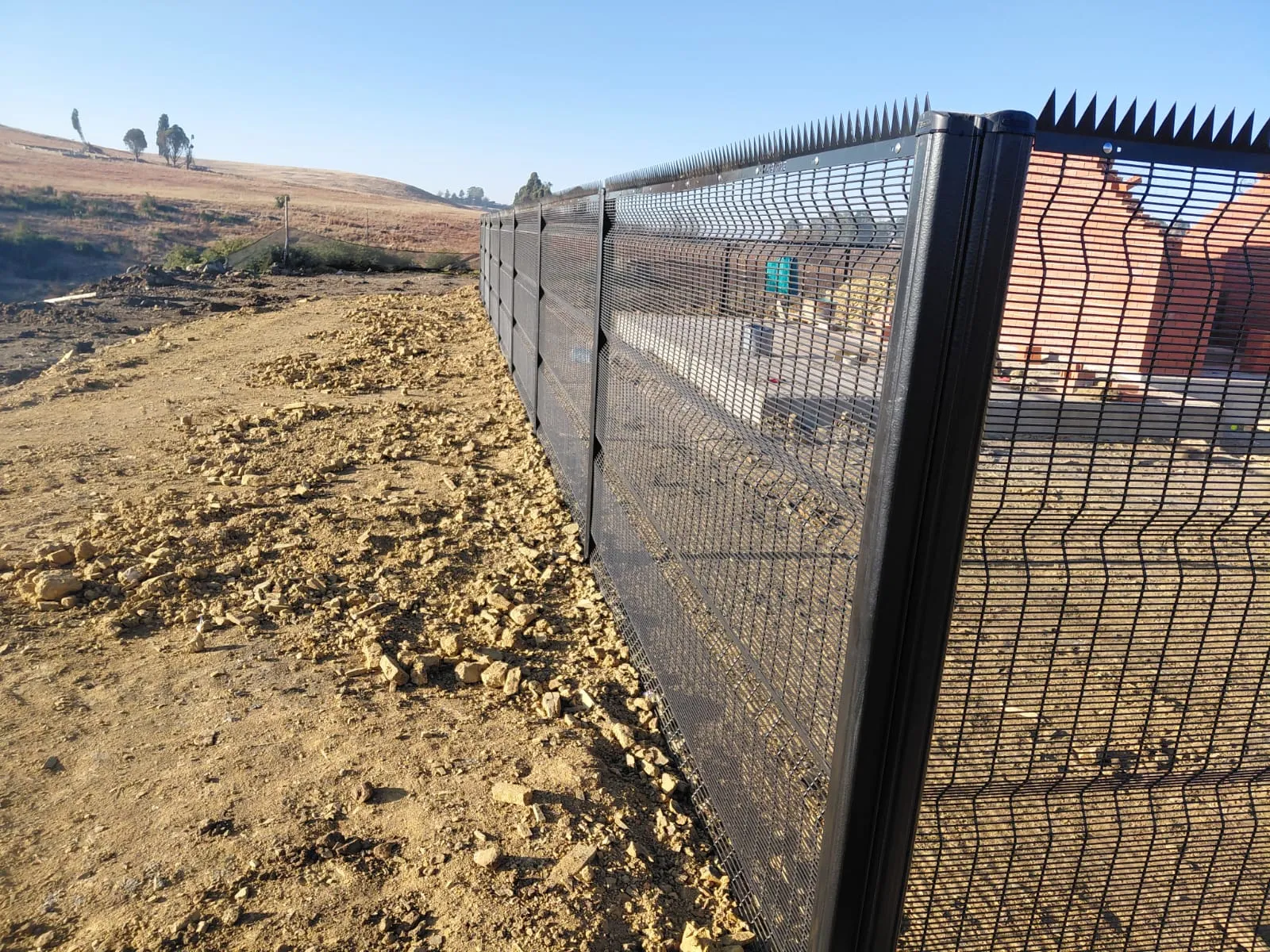 Capstone perimeter fence installation progress 10