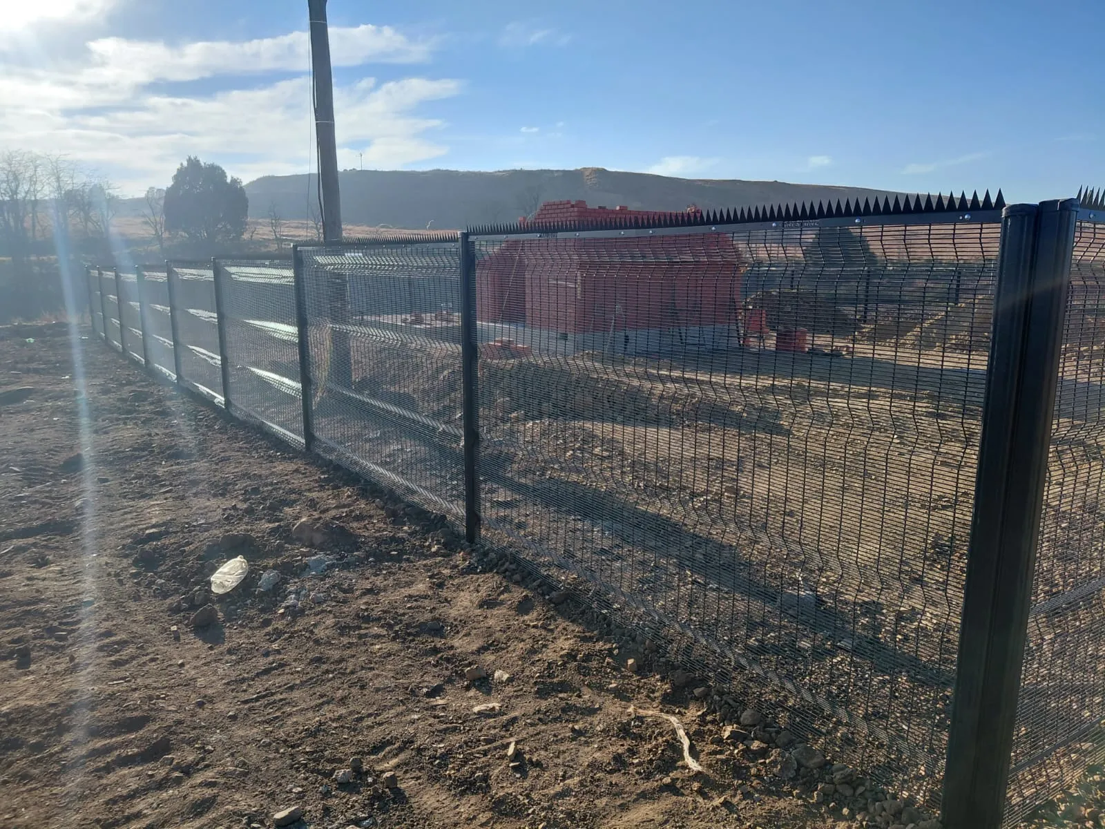 Capstone perimeter fence installation progress 15