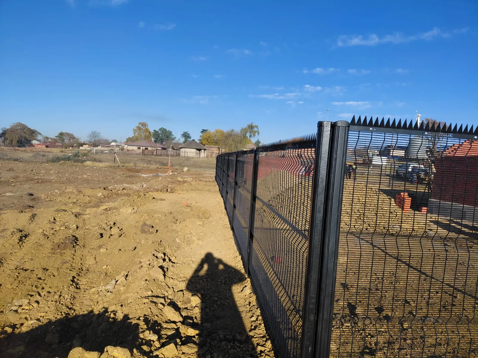 Capstone perimeter fence installation progress 18