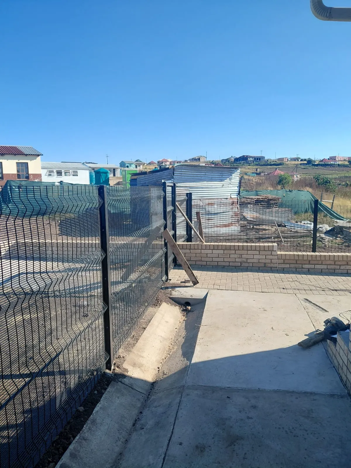 Capstone perimeter fence installation progress 26