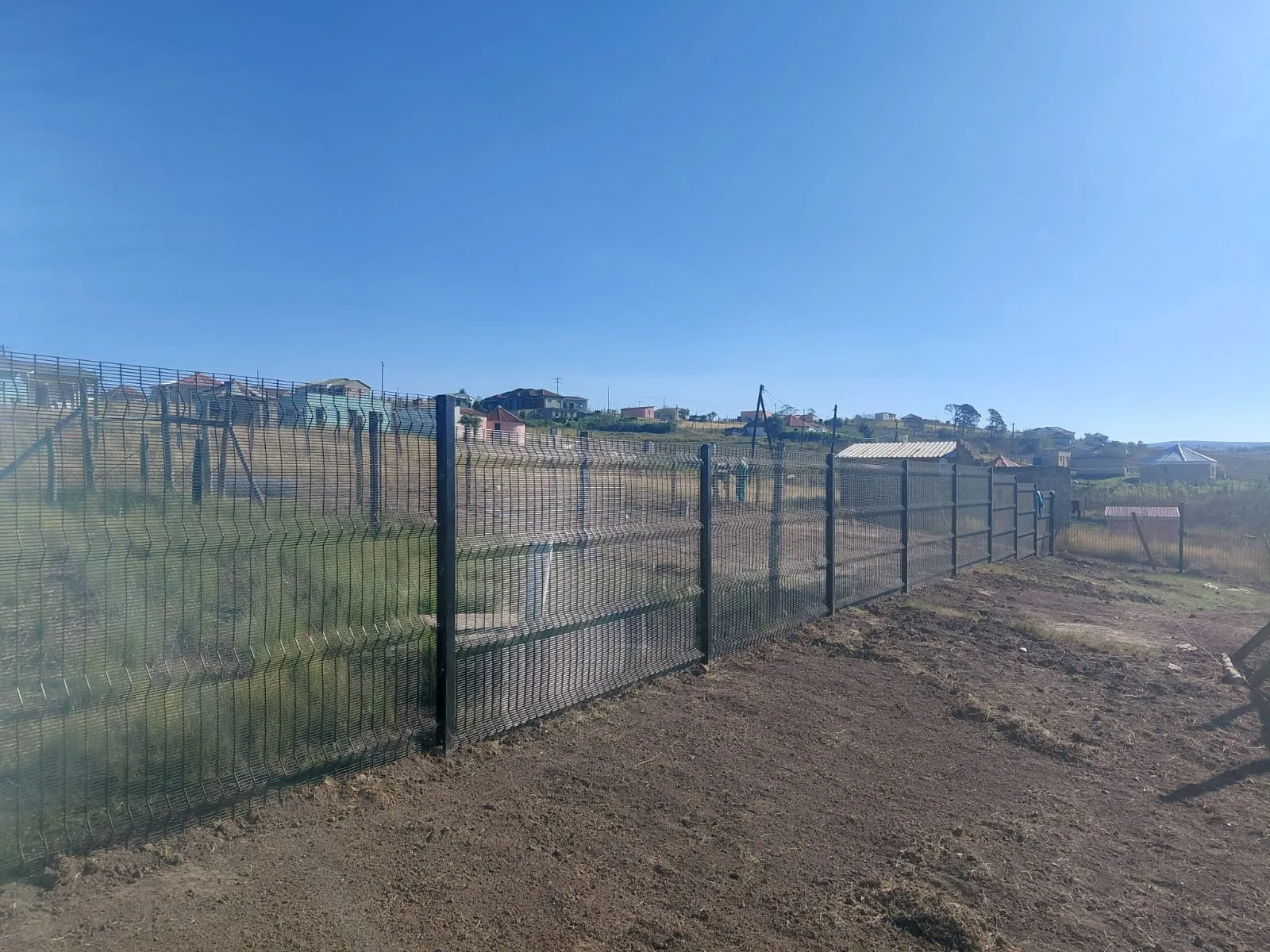 Capstone perimeter fence installation progress 27