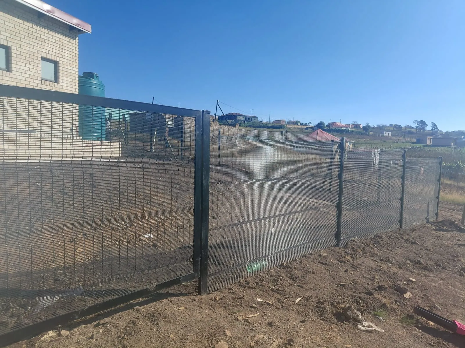 Capstone perimeter fence installation progress 29