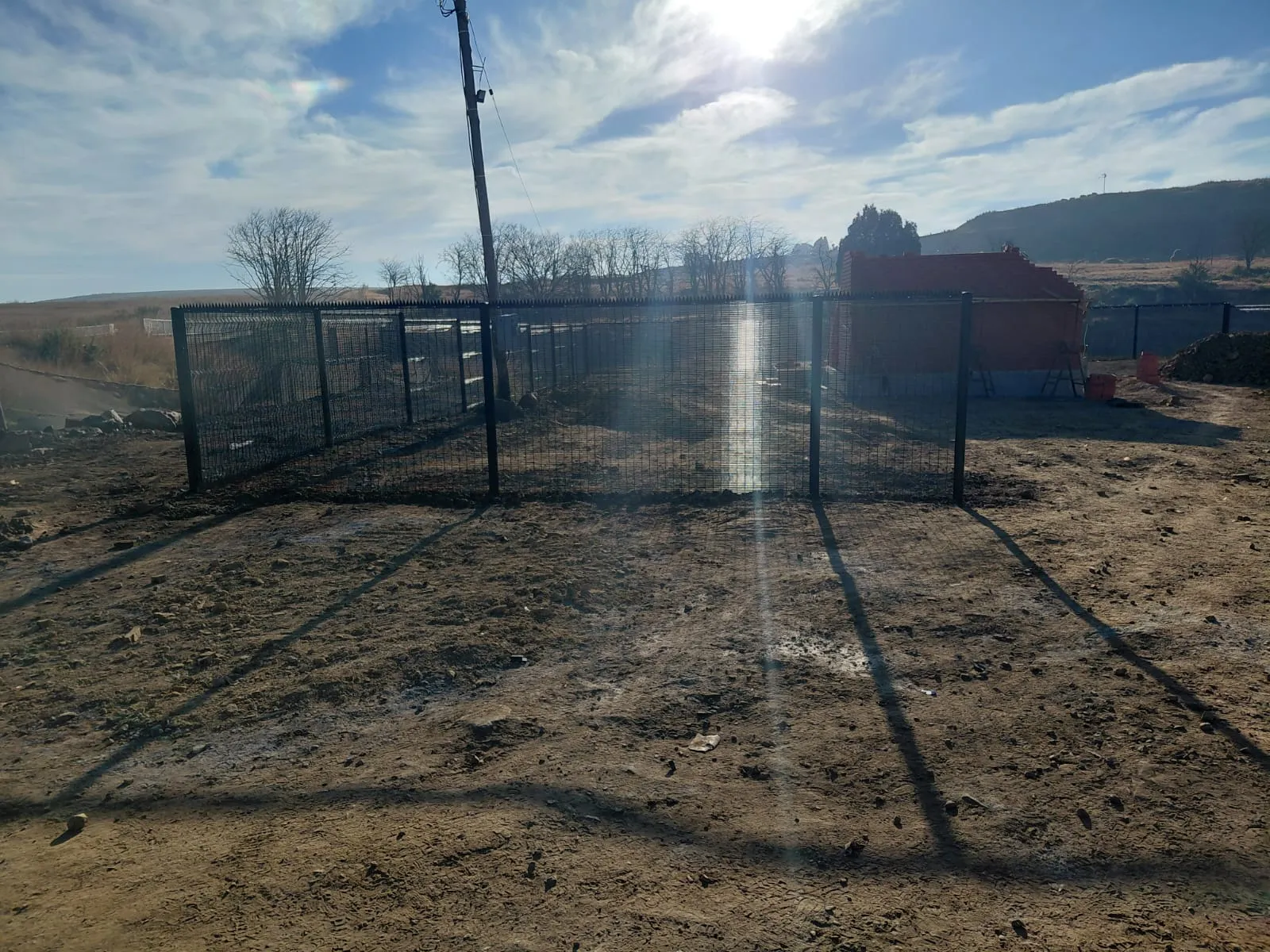 Capstone perimeter fence installation progress 31