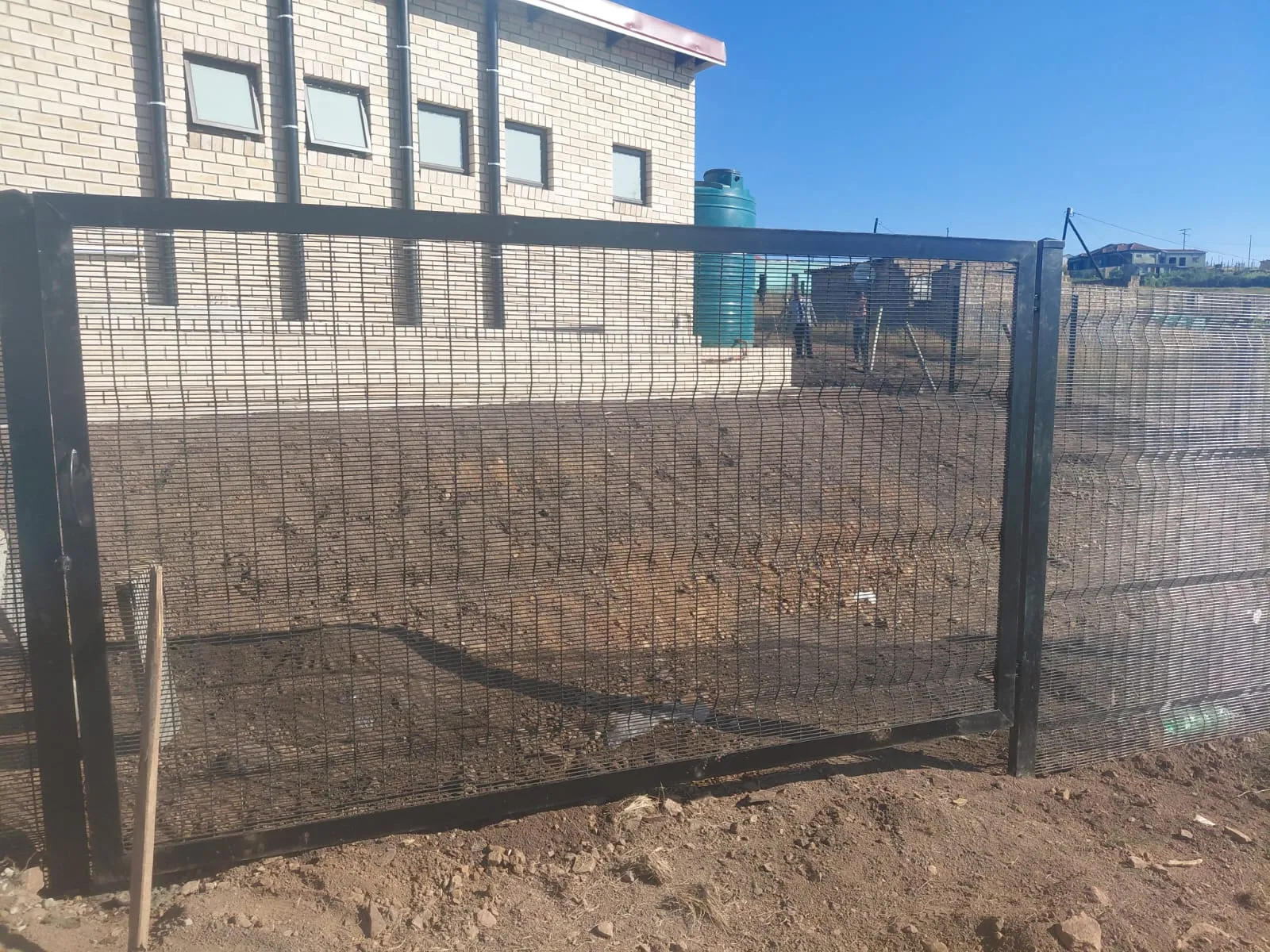 Capstone perimeter fence installation progress 37